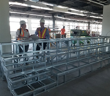 Employees working on steel structure